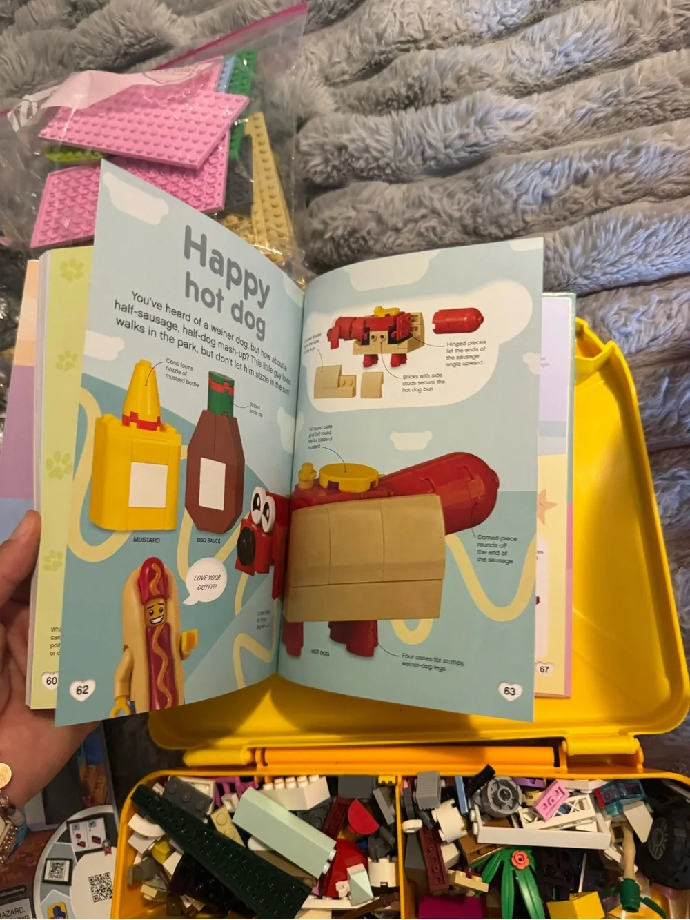 Lego Yellow and Orange Carry Cases filled with Lego bricks and a bag of boards